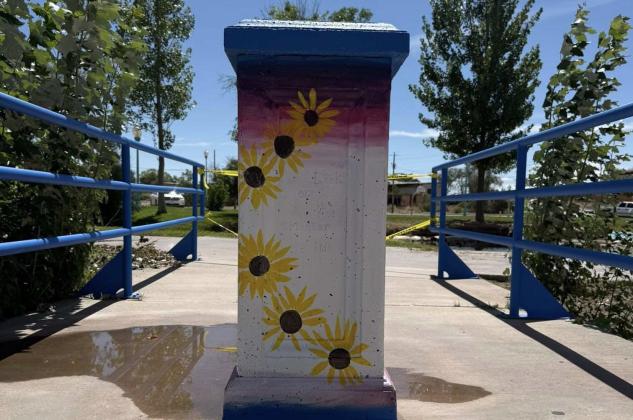 A pillar at Riverwalk Park brightens with hand-painted sunflowers, part of the Grants MainStreet Project’s mural initiative involving students and community volunteers to beautify the City of Grants’ parks and downtown area. Courtesy Photo