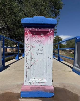 “Everyday is a New Bloom” — a freshly painted pillar carries an uplifting message as part of the Riverwalk revitalization led by Grants MainStreet. Courtesy Photo