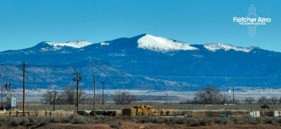Mount Taylor, towering over Cibola County with its snow-capped peaks, stands at the center of a growing political and environmental battle. As New Mexico lawmakers move to reaffirm its protection as a Traditional Cultural Property, the Trump administration pushes to prioritize uranium mining projects in the region. The mountain, sacred to multiple Indigenous nations, faces renewed threats as the federal government shifts its focus toward energy development. Courtesy Photo by Matt Fletcher