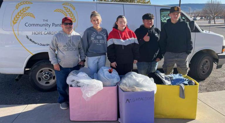 Tommy Gabaldon (left), teacher of Grants High School Service Learning Class with students and their donations to The Community Pantry. PHOTO – Courtesy