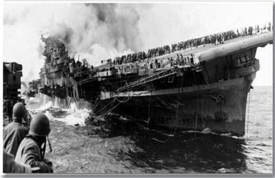 The USS Franklin (CV-13), one of the most decorated aircraft carriers of World War II, pictured before the attack that nearly sank her. General Ahniwake Ray, then 18 years old, was serving aboard as a fireman when two bombs struck the ship off the coast of Japan on March 19, 1945. Courtesy Photo