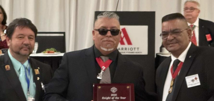 State Program Director Sean Romero, left, stands with Chris Madrid Jr., center, after Madrid was named Knight of the Year at the New Mexico Knights of Columbus State Convention. Madrid is the first member of the local Knights of Columbus chapter to receive this honor. Also pictured is State Deputy Anthony Salazar, right. Courtesy Photo