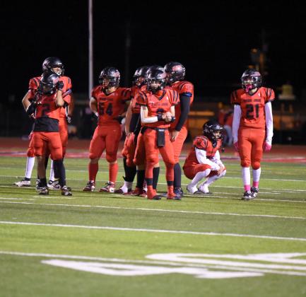In this file photo the Pirates regroup on the field at a recent home game. The Pirates after receiving an eighth seed to the NMAA state 4A football tournament were defeated last Friday by the ninth seeded Academy Charges by a score of 35-7. 'I can truly say that the coaches and players believed we could make the playoffs---in the end it was awesome for the kids, the coaches and the community,' said coach Brown. Franklin Romero - CC