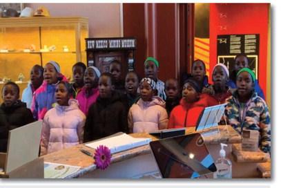Members of the African Children’s Choir sing a heartfelt thank you at the Grants-Cibola County Chamber of Commerce on Thursday, January 23. The choir expressed their gratitude to the people of Cibola County for their warm hospitality and support during their visit for the 40th-anniversary concert. Courtesy of the Grants-Cibola County Chamber of Commerce