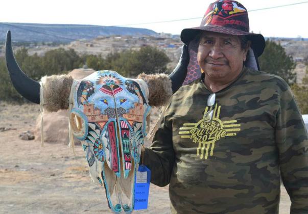 The artist with his painted buffalo skull. Kathryn Marmon - CC
