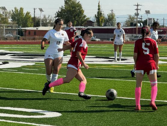 Let’s go!! Annalisa Lowther (22) battling for the ball against St. Pius at a recent home soccer game.