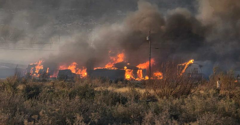 A wall of fire tears through homes off East Sage in Grants on Sunday evening. The fast-moving Alamo Fire destroyed six residences, injured two firefighters, and displaced multiple families. Franklin Romero - CC