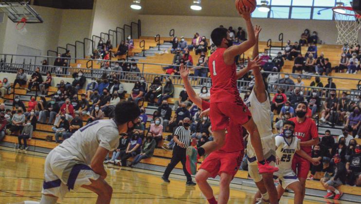 GHS senior Adam Garcia,1, with a successful lay-up, which was later called back, at a recent game at Miyamura High School. The Pirates are 1-1 after dropping a game to the Gallup Bengals, 72-44 then defeating Miyamura 45-43. They face a trio of home games this week starting with Kirtland Central on Tuesday, April 6.. Franklin Romero. - CC