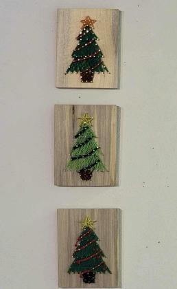The Cibola Arts Council holds regular events for the community and especially children to get their creative sides moving. The efforts by CAC include their most recent event where area artists created these string art Christmas trees. Courtesy Photo