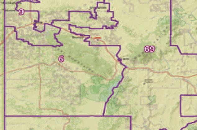 A map showing the boundaries of New Mexico House Districts 6 and 69. District 6, spanning parts of Cibola and McKinley counties, includes communities such as Thoreau, Crownpoint, and Zuni. District 69, to the east, encompasses Grants and Acoma Pueblo.