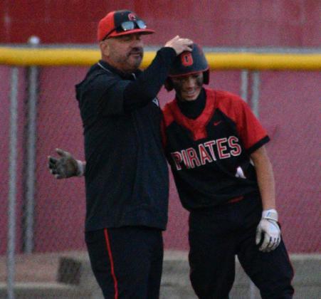 The Grants High School baseball team came up short, losing to Saint Pius 8-7 and 7-3 in a best of 3 series thus ending their run at the 4A state baseball tournament. In this photo head coach Mike Furbee adjusts the helmet of one of his players, Floyd Lee, at third base. Courtesy Photo