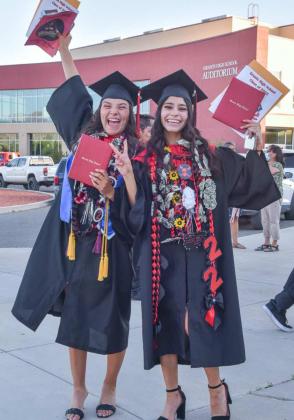 "Besties" Marina Lucero (L) and Mia Apodaca (R) celebrate after receiving their diplomas at the graduation ceremony. The two seniors have been good friends all through high school. Franklin Romero - CC