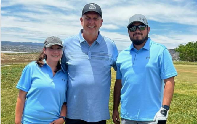 Matthew(R) and Rochelle Loera(L), former residents of Grants, pose with Ty Detmer(middle) at a golf tournament held this past Saturday. The golf tournament was part of the Ty Detmer DYFL All-Star camp. Detmer is a 1990 Heisman Trophy winner and played in the NFL for 14 seasons. Franklin Romero - CC