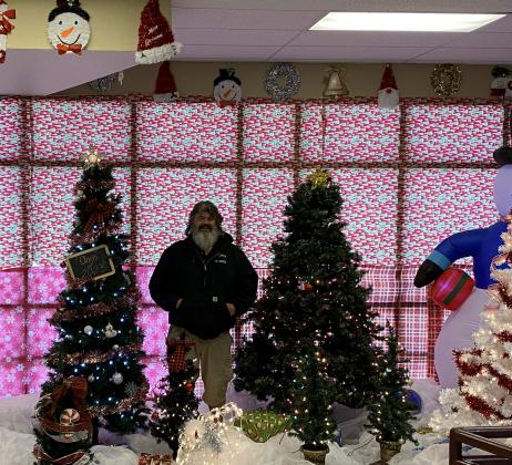 David Marsing, pictured was excited to showcase the winter wonderland he sets up every year at Grants High School. Several students remarked on how seeing the decorations lights up their day and brings a little bit of spirit in their busy academic day. CC – Nicholas Montoya