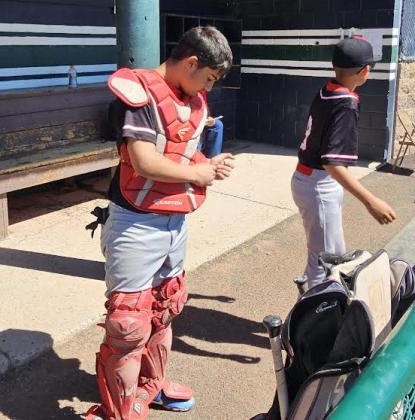 Colin Lundstrom played catcher most of the season for the Bucs. Here, he prepares for action at the Rio Rancho Tournament. Lundstrom, who bats from the left side, led Los Alamitos in batting average and RBIs this season. Richard Sanders - AJJ