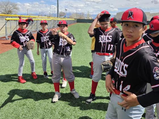 The Los Alamitos baseball team members are shown here preparing for a ball game. Richard Sanders - AJJ
