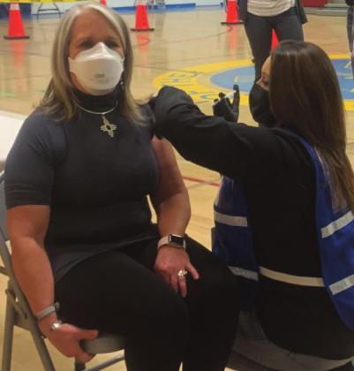 Governor Michelle Lujan Grisham receives her first shot of the Pfizer BioNTech COVID-19 vaccine, saying that even though she is now partially vaccinated, she will continue wearing a mask until it is safe to remove them in public spaces. Courtesy photo