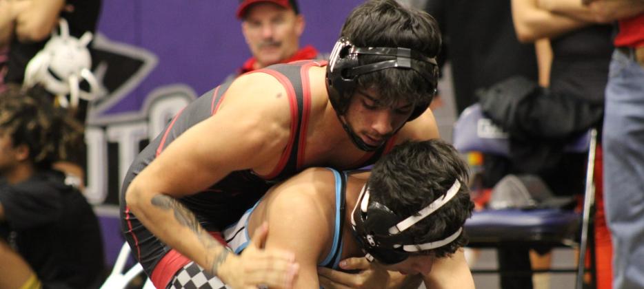 Senior Manuel Gonzales in one of his matches this past weekend at the Grants Pirates Invitational. The Pirates were placed second at their home meet with 125.5 points. Gonzales placed first in the 127 pound weight class. Franklin Romero - CC