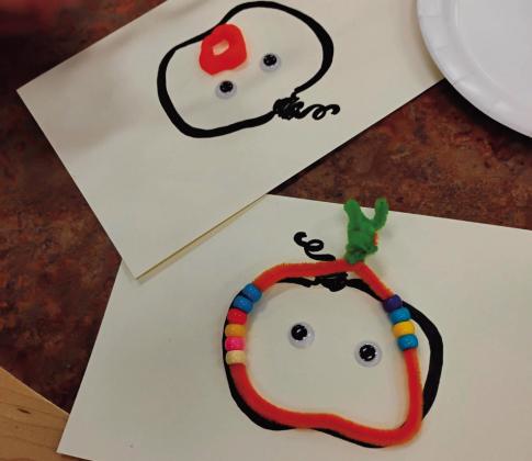 A child creates pumpkin-themed artwork during the Oct. 8 Picasso Babies and Tot and Me activity at the Grants Public Library. Courtesy Photo
