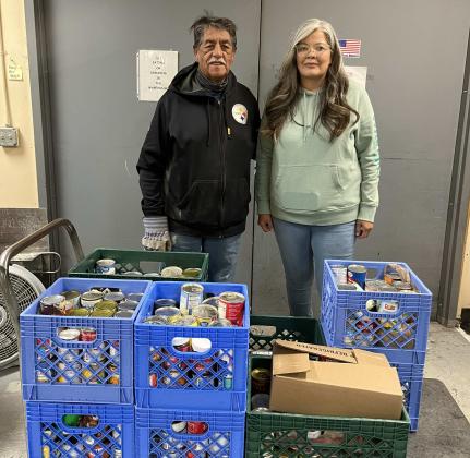 Chris Madrid (left), a member of the Knights of Columbus, and Vanessa Frank, an employee of the Navajo Nation who is currently assisting The Gants Community Pantry. PHOTO – Courtesy