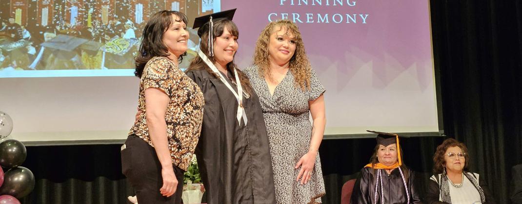 Vanessa Jarmillo-Chavez pinned by her mother Rubby Jaramillo and her daughter Shantel Jaramillo-Valdez. Arieanna Crowson – CC