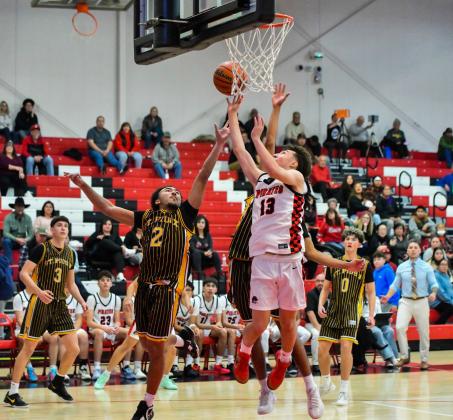 Sophomore Daniel Garcia, 13, with a bucket in transition in last week’s district game against St. Pius (7-11). The Pirates are 11-8 and 1-1 in district and will play a tough Highland squad (13-4,1-0) on January 27th on the road. The Pirates are ranked 11th in 4A boys basketball. Franklin Romero - CC