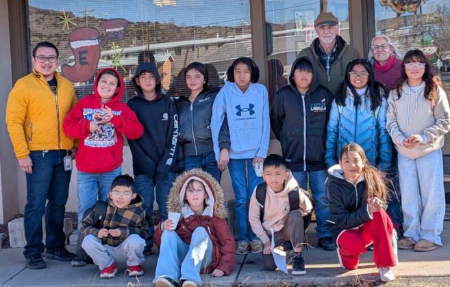 For the eighth year in a row, Evelyn and Roger Siegmann have teamed up with students from the various elementary schools in Grants-Cibola County School District to spread holiday cheer. In this photo, taken December 1 by Citizen staff, students from Mesa View Elementary School painted the newspaper windows. Not pictured is Joe and Misty Vigil who helped to keep the students focus and spread cheer. Sylvia Anzures Gonzales - CC