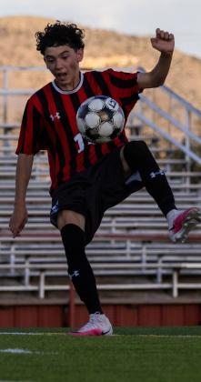 Jesus Murillo, a sophomore on the Grants High School boys’ soccer team, controls the ball out of the air during the Pirate’s match. Jay Langford- Student Journalist