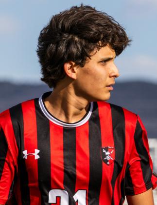 Joaquin Gomez a senior on the Grants High School boys’ soccer team watches the field as the pirates prepare for the next play. Jay Langford- Student Journalist
