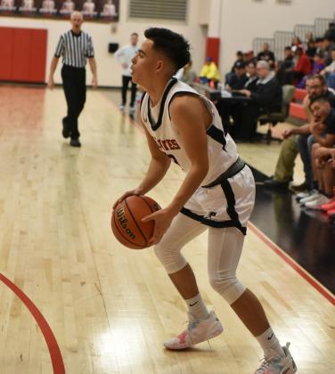 Senior Isaiah Griego (23), of the Grants Pirates varsity basketball team, steadies himself for a trey at a recent home game. The ninth ranked Pirates will take on the 10th ranked Valencia Jaguars (10-7) on Tuesday, January 23 on the road in their district opener. The Lady Pirates (3-13) will host the Lady Jaguars of Valencia (10-7) on Tuesday Jan. 23 as they also begin district play. Franklin Romero - CC