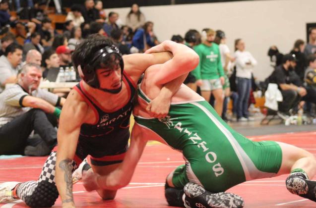 Senior Manuel Gonzales dominating a recent wrestling match at St. Pius High School. Gonzales placed third in the 127-pound weight class at that meet Courtesy Photo