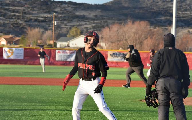 The Grants High School Pirates shut down the Highland Hornets,16-0, last week and are in a solid second place in the state rankings for 4-A and first place in district 4-4A. In this file photo, Estevan Barela, 6, is at home plate after scoring a run. Franklin Romero - CC