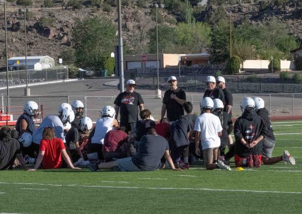 The GHS Pirate football team huddles with the coaching staff for a post practice talk at the Port of the Pirates. Franklin Romero - CC