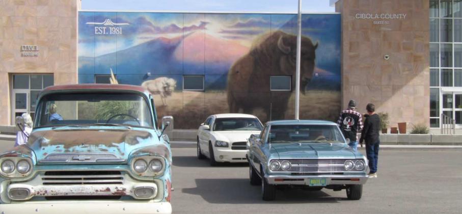 Photo by Roger Siegmann Car fools at Cibola County complex in front of mural