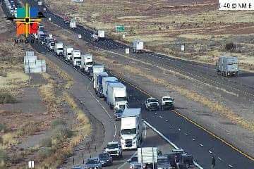 A long line of vehicles remains stopped on eastbound I-40 at NM 6 (Exit 126) while the crash scene is investigated and traffic continues to be diverted. Courtesy: NMDOT traffic camera