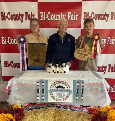 Edea Graham with the Reserve Grand Champion Rabbit Meat Pen Courtesy Photo