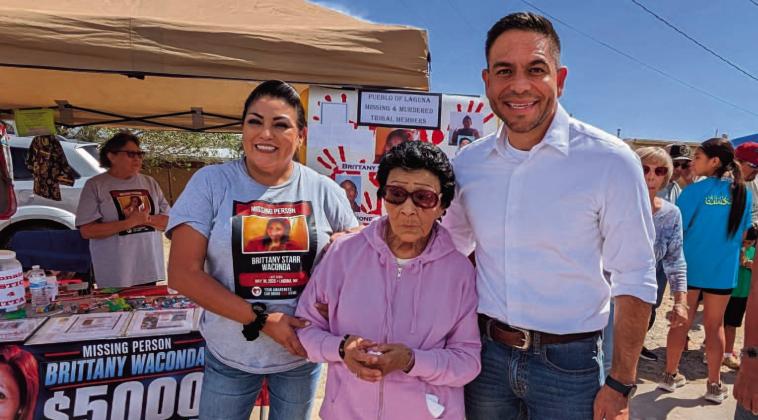 Autumn Waconda, left, stands with family and visitors at the Missing and Murdered Indigenous Women and Relatives booth during Laguna Feast. Autumn said Gabe Vasquez, right, visited the booth and offered to make a congressional inquiry to the Bureau of Indian Affairs regarding Brittany Starr Waconda’s case. Courtesy Photo