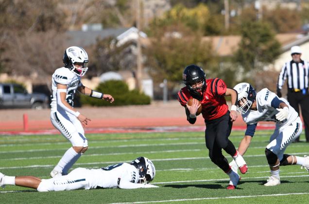 Running back Andres Lazos, 2, slipping by the Silver defense this past Saturday in the first round of the state 4A football playoffs. Lazos had 56 rushing yards in that game. Franklin Romero - CC