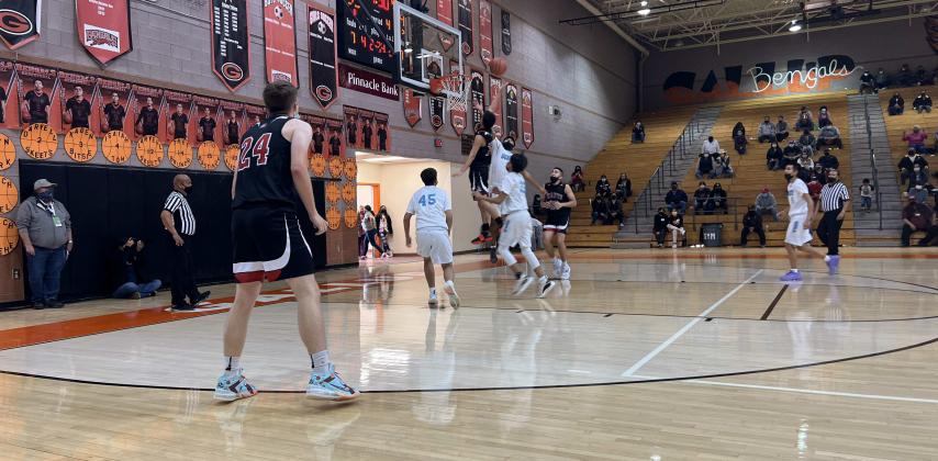 The Grants High School basketball team is 'ready to work' according to head coach Landon Chavez. They will begin their season on Tuesday, November 22 against Bloomfield High School. In this file photo, Isaiah Hernandez, one of last year's eight seniors takes the ball to the hole in a recent game against the Gallup Bengals at Gallup High School. Franklin Romero - CC