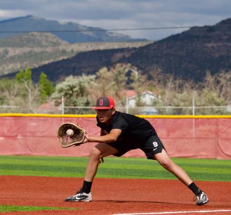 Bryan Antonio: Grants High School first baseman Bryan Antonio fields a ground ball during practice Aug. 13 at the GHS baseball field. Jay Langford- Student Journalist