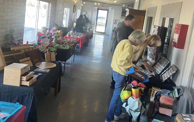 Shoppers browse vendor tables and handmade goods during the Christmas Float Festival and downtown holiday activities Saturday, Dec. 13, after the City of Grants recommended cancelling the annual Holiday Light Parade over safety concerns. Courtesy Photo