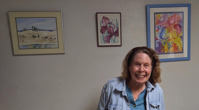Joan Sheski, Cibola County artist, stands in front of her artwork on September 17, 2026. Amerika Rougemont - CC