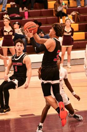 Senior Boudy Melonas, 3, with a bucket on his way to 1,000 career points as a varsity player on the GHS boys basketball team. Melonas made his 1,000 points at the district game at Belen last Saturday. Melonas has been a consistent high scorer for 4 years with the Pirates and hitting the 1,000 career points is a rare achievement in high school basketball. Congratulations to Boudy on a job well done. Franklin Romero - CC