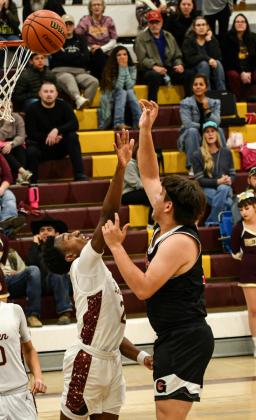 Senior Dominick Gonzales, 34, with a post move on Belen this past Friday, The GHS boy basketball team defeated district rival the Belen Eagles in overtime, 64-61, this past Friday. The lost to Wingate on Saturday by a score of 47-44 and are currently 11-10 and 3-1. Franklin Romero - CC