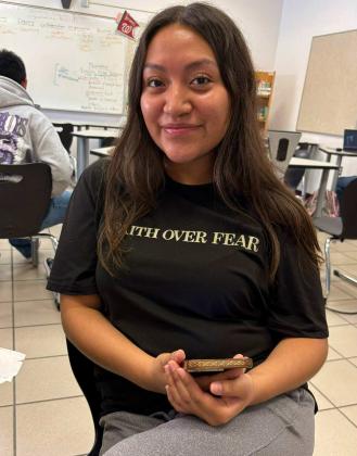 Maura Galindo, wearing a tee-shirt with the words, `Faith Over Fear,' will graduate with her fellow seniors this Friday night, May 16. Courtesy Photo
