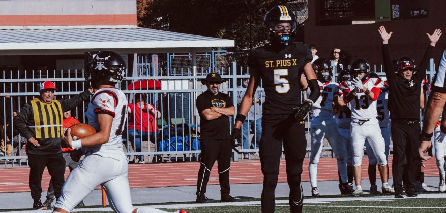 Julian 'JuJu' Fernandez, 12, with a touchdown from his brother and GHS quarterback Tristin Fernandez, 5, this past Saturday in the quarter finals 4A football game against St. Pius. Franklin Romero - CC