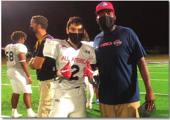 Bryan Hernandez, a senior at Grants High School, poses with his Coach after the All-America Classic game where Hernandez scored the game winning touchdown. Courtesy photo