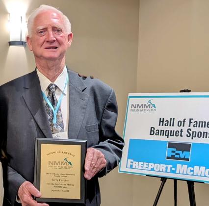 Terry Fletcher holds the plaque marking his induction into the New Mexico Mining Association’s Mining Hall of Fame on Sept. 9, 2025. Fletcher, who grew up in Grants, led Rio Algom Mining and has been a decades-long supporter of local civic, economic, and museum boards. Courtesy Photo