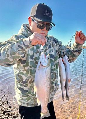 Jimmie Begay Jr. caught five rainbow trout using Garlic PowerBait on March 9. “This was the biggest rainbow trout I’ve caught,” he said. “Bluewater Lake was some good fishing.” Serena caught her first trout using Power-Bait while fishing with her grandmother, Nadine Delgarito Gordon, on March 10. Courtesy Photo