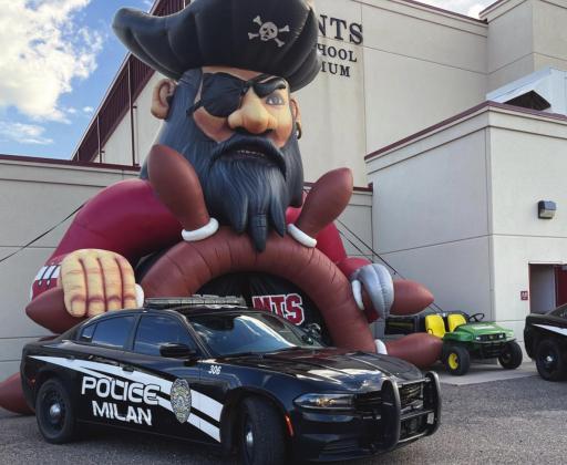 Milan Police Department vehicles help introduce the 2021-2022 Pirate football team for their first home game of the year against Capital High School. The defensive coach for this team is Officer Josh Pacheco of MPD who helped to organize the introduction, a display that MPD supports the community it works in and around. Courtesy photo